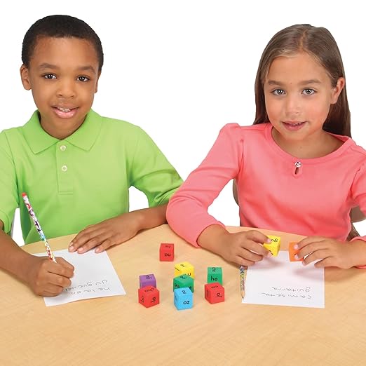 Really Good Stuff Make-a-Word Soft Touch Spanish Syllable Dice Game – Grades K–2 – Expand Word-Building Skills – Includes 15 Same-Vowel Syllable Dice, 3 Mixed-Vowel Dice – Dice Color-Coded by Vowel