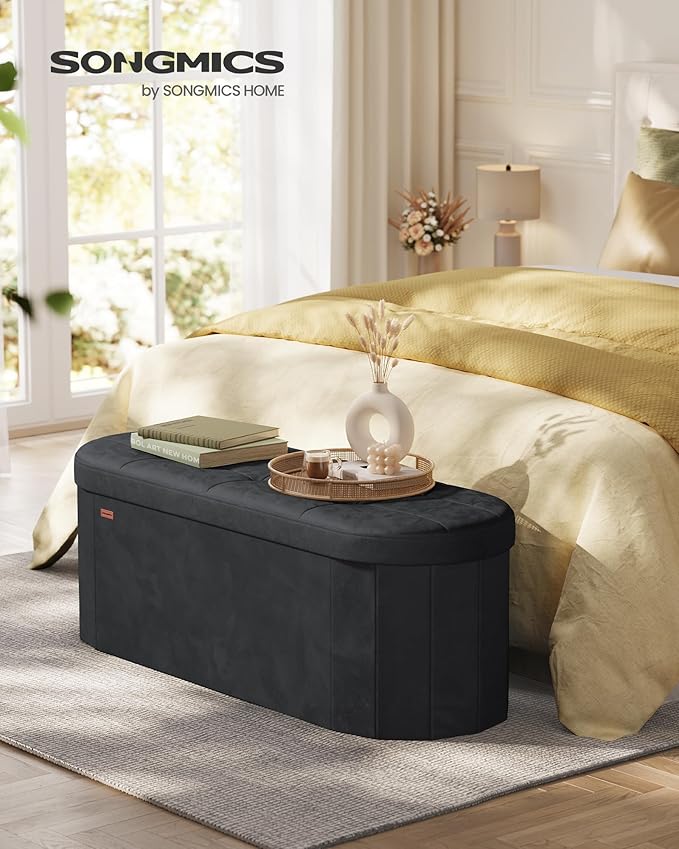 SONGMICS Mazie Collection - Folding Ottoman with Storage, Oval Storage Ottoman Bench, for Living Room, Bedroom, Velvet Fabric, 15 x 43 x 15 Inches, Ink Black ULSF297BH01